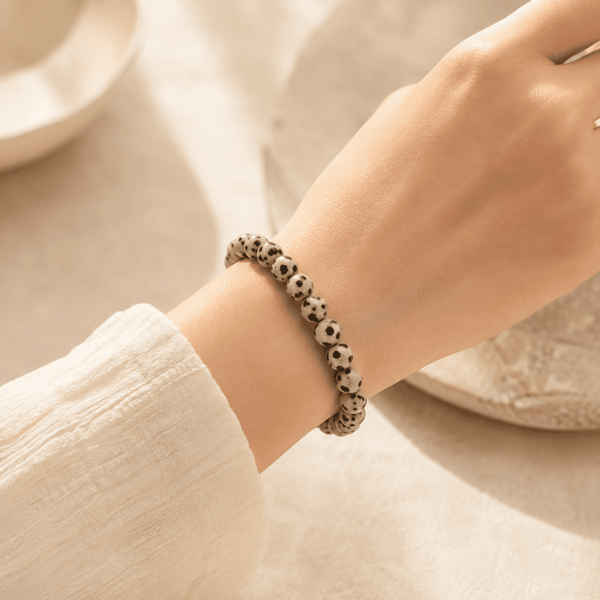 Dalmatian Jasper Bracelet – Playful Grounding | Lumina Quartz - wearing